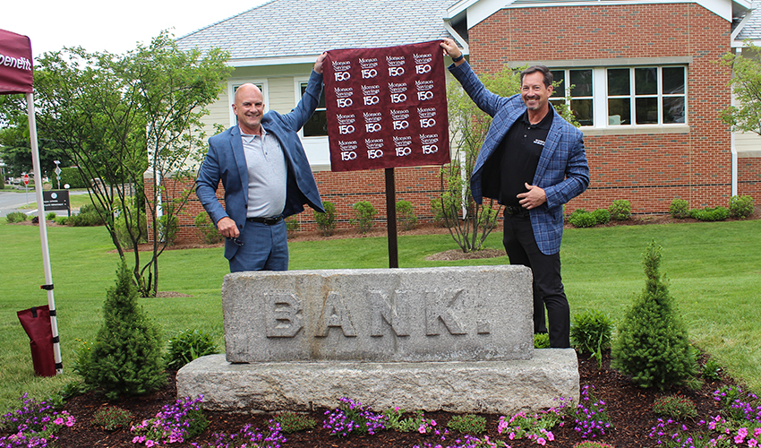 Dan Moriarty, President and CEO of Monson Savings Bank and Michael Rouette, EVP and Chief Operating Officer of Monson Savings Bank are shown moments before unveiling the historic plaque which is covered by a custom made cover designed by Heather Arbour, BSA Officer & Compliance Manager of the Bank.