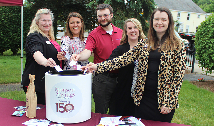 BSA Officer & Compliance Manager Heather Arbour, Commercial Portfolio Manager Catherine Rioux, e-Banking Division Officer Paul Shepardson, Assistant Vice President Carolyn Balicki, and Business Relationship Manager Aimee Kohn add their business cards to the time capsule.